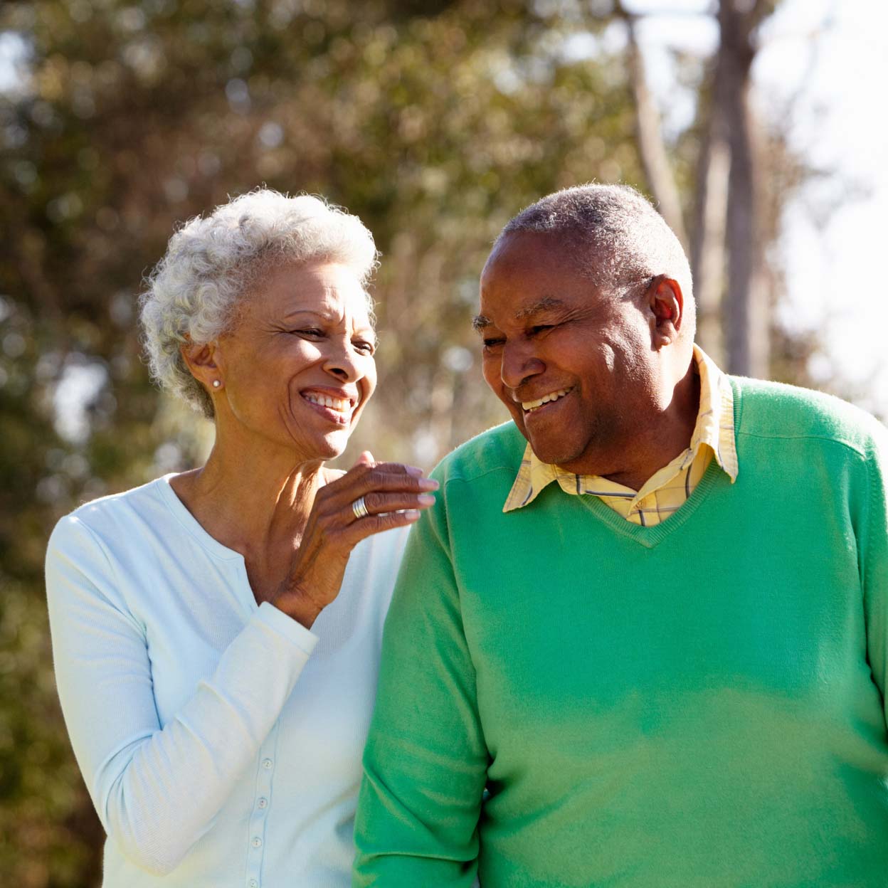 elderly couple walking and talking